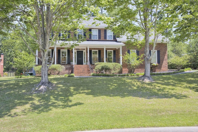 467 Baker Woods Trl, Martinez, GA 30907 - view of front of house with a porch, a front lawn, and brick siding