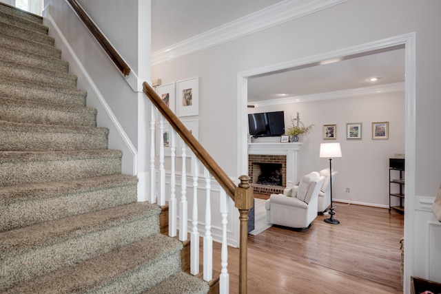467 Baker Woods Trl, Martinez, GA 30907 - stairs featuring a brick fireplace, recessed lighting, ornamental molding, and wood finished floors