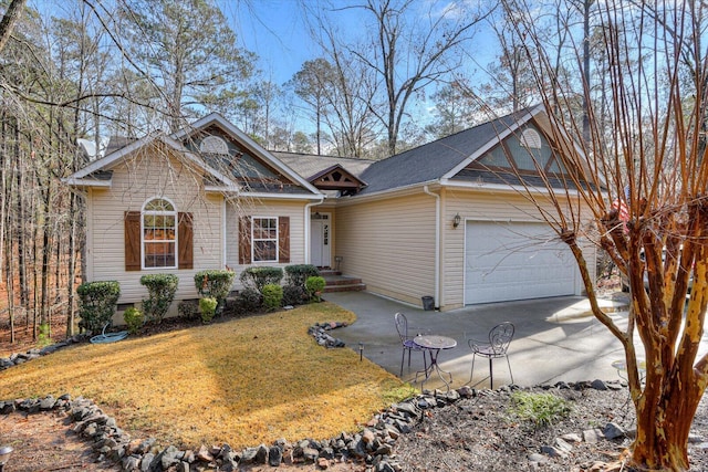 single story home featuring a front lawn and a garage