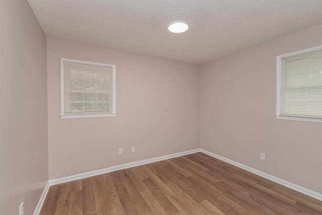 153 Campbell Cir, Hephzibah, GA 30815 - spare room with wood finished floors and a textured ceiling