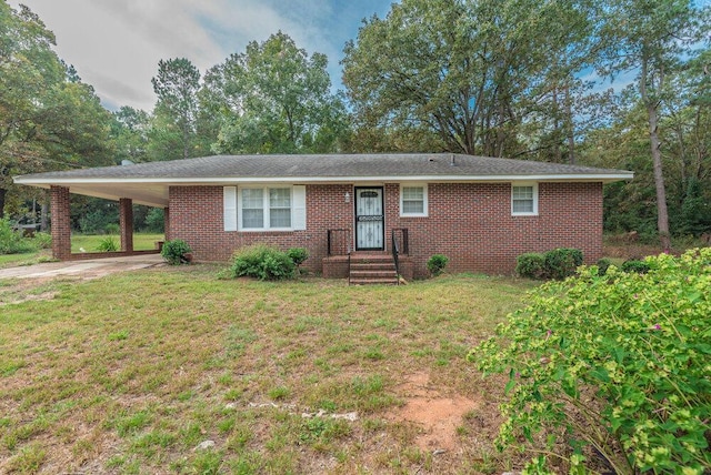 153 Campbell Cir, Hephzibah, GA 30815 - single story home with a front yard, an attached carport, brick siding, and driveway