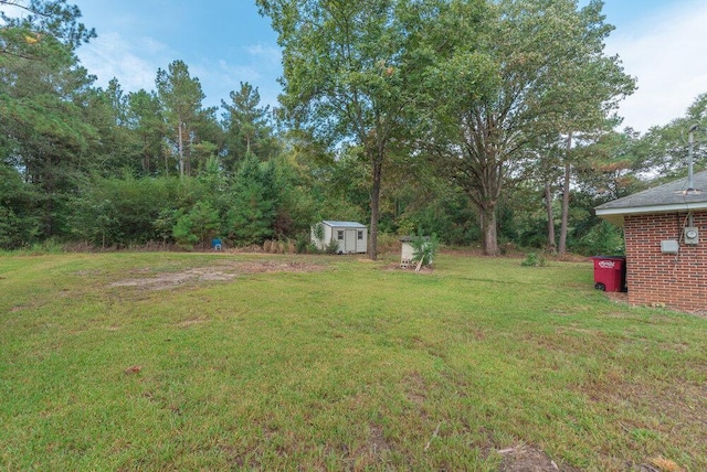 153 Campbell Cir, Hephzibah, GA 30815 - view of green lawn with a storage shed