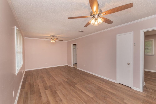 153 Campbell Cir, Hephzibah, GA 30815 - unfurnished room with a ceiling fan, a textured ceiling, wood finished floors, and ornamental molding