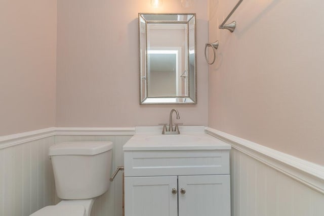 153 Campbell Cir, Hephzibah, GA 30815 - half bathroom with wainscoting, vanity, and a decorative wall
