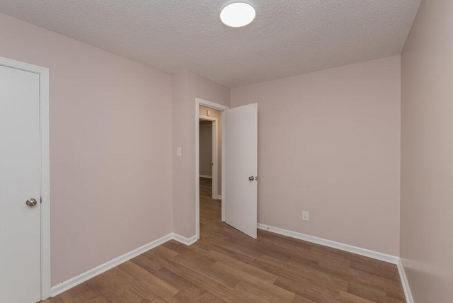 153 Campbell Cir, Hephzibah, GA 30815 - spare room featuring wood finished floors and a textured ceiling