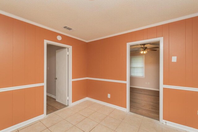 153 Campbell Cir, Hephzibah, GA 30815 - spare room with crown molding, a textured ceiling, a ceiling fan, and light wood-type flooring