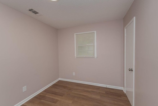 153 Campbell Cir, Hephzibah, GA 30815 - unfurnished room with wood finished floors and a textured ceiling