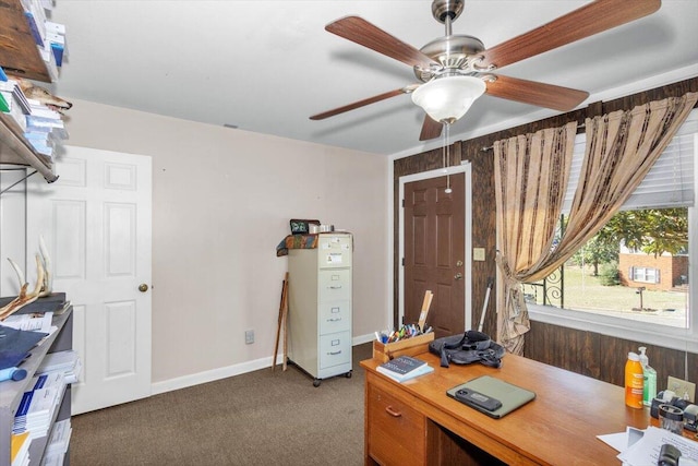 home office with carpet flooring, ceiling fan, and baseboards