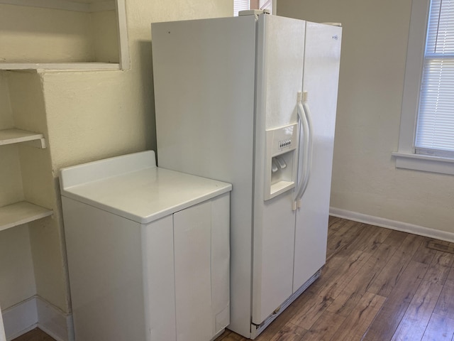 clothes washing area featuring hardwood / wood-style floors