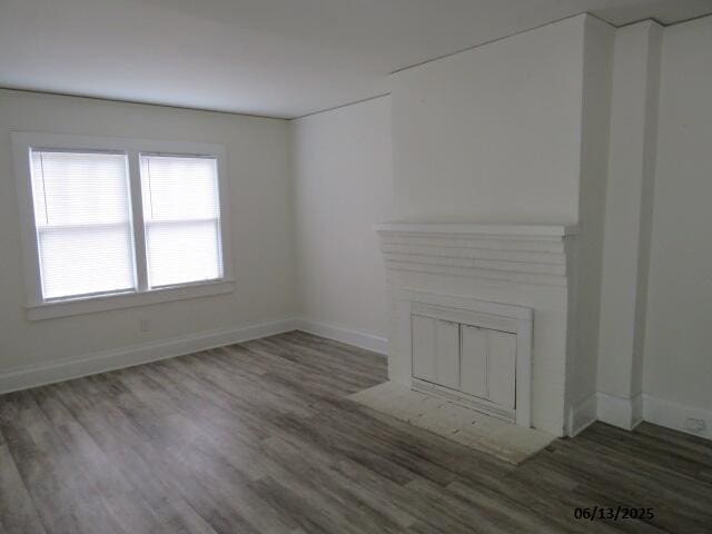 1642 Whitney St, Augusta, GA 30904 - unfurnished living room featuring wood finished floors and baseboards