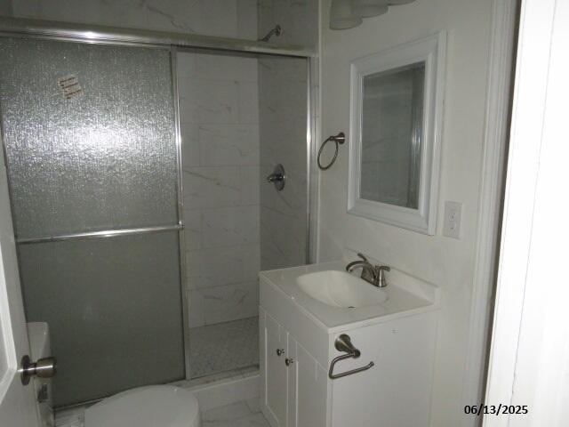 1642 Whitney St, Augusta, GA 30904 - bathroom featuring a shower stall, vanity, and marble look tiles