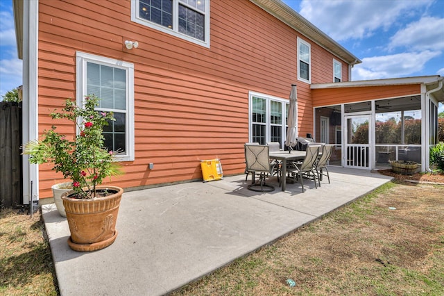 view of patio featuring a sunroom