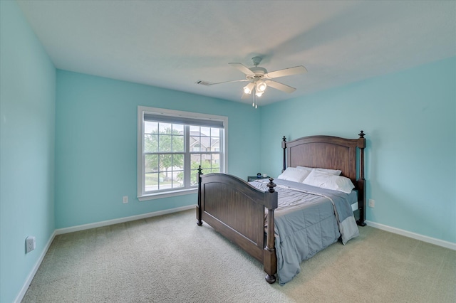 bedroom with light colored carpet, baseboards, ceiling fan, and visible vents