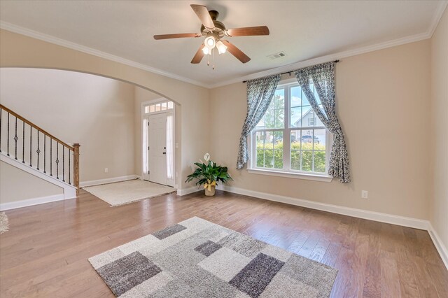 509 Sagebrush Trl, Evans, GA 30809 - foyer entrance with arched walkways, baseboards, stairs, and wood finished floors