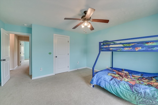bedroom featuring baseboards, carpet, and a ceiling fan