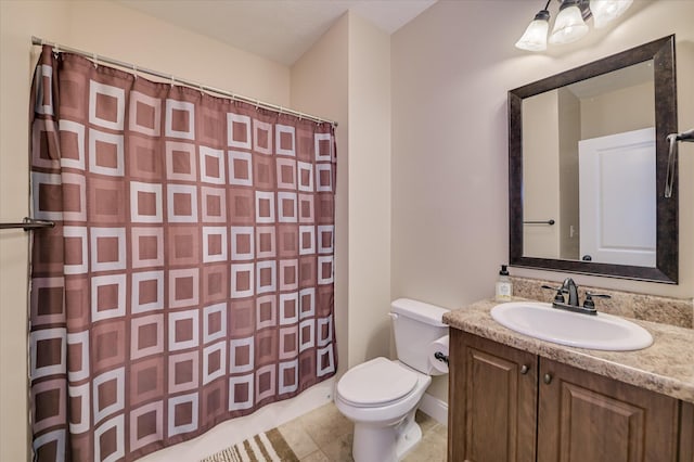 bathroom featuring vanity, curtained shower, toilet, baseboards, and tile patterned floors