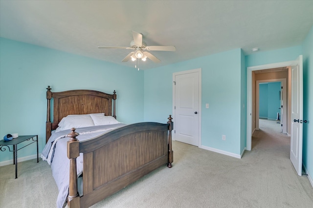 bedroom featuring a ceiling fan, baseboards, and light colored carpet