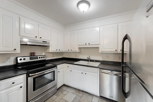 50 Bluff Pointe Way, Aiken, SC 29803 - kitchen featuring under cabinet range hood, appliances with stainless steel finishes, a sink, dark countertops, and white cabinetry