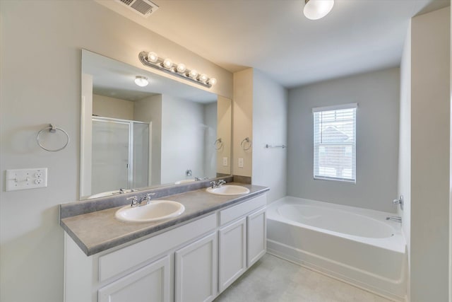1052 Dietrich Ln, North Augusta, SC 29860 - bathroom featuring double vanity, a garden tub, and a shower stall