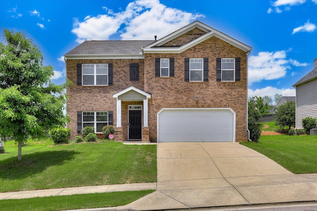 1052 Dietrich Ln, North Augusta, SC 29860 - view of front of house featuring an attached garage, a front lawn, driveway, and brick siding