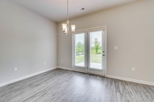 1052 Dietrich Ln, North Augusta, SC 29860 - unfurnished room with a chandelier and wood finished floors