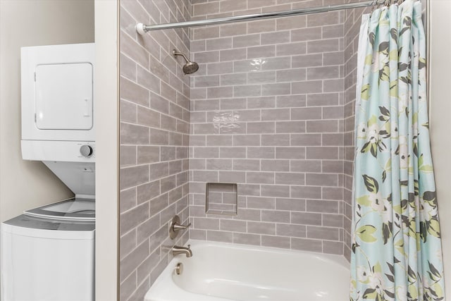 bathroom featuring shower / bath combo and stacked washer / dryer
