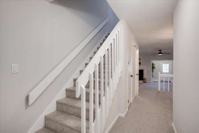 staircase with ceiling fan