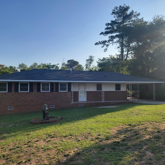 2514 Cascade Dr, Augusta, GA 30904 - view of front of home with brick siding, a front yard, and a carport