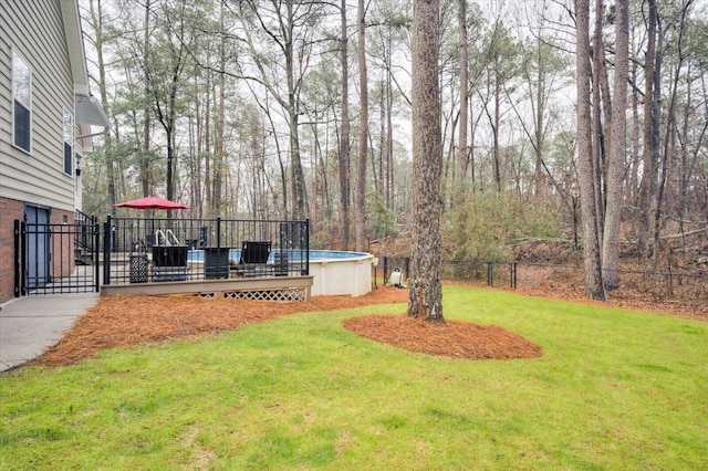 view of yard featuring a swimming pool side deck