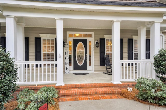 doorway to property with covered porch