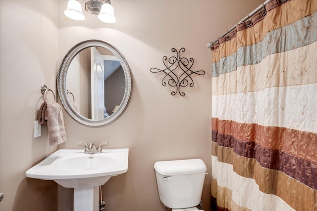 bathroom with sink and toilet