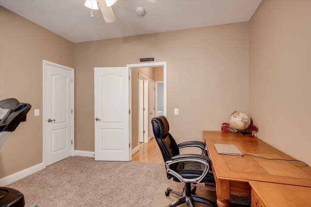 office with ceiling fan and light carpet