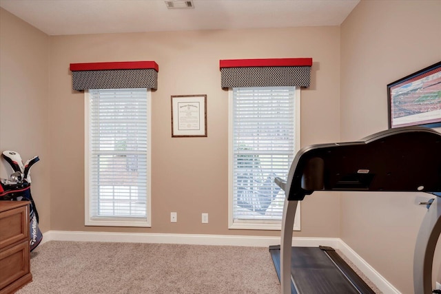 exercise area with light colored carpet