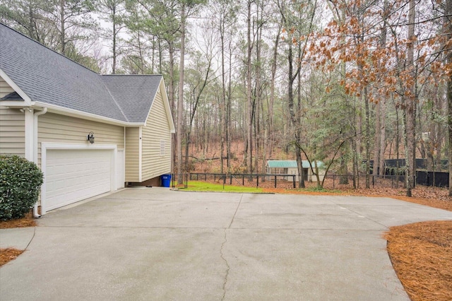 view of side of property with a garage