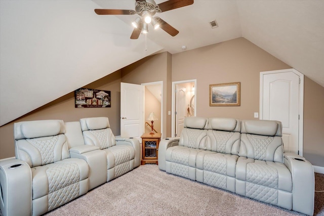 living room featuring ceiling fan, lofted ceiling, and carpet