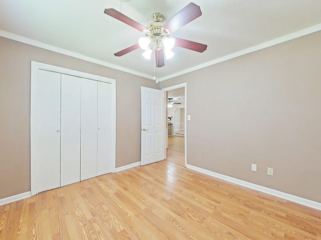 4532 Oakley Pirkle Rd, Martinez, GA 30907 - unfurnished bedroom featuring wood finished floors, a closet, ornamental molding, and ceiling fan