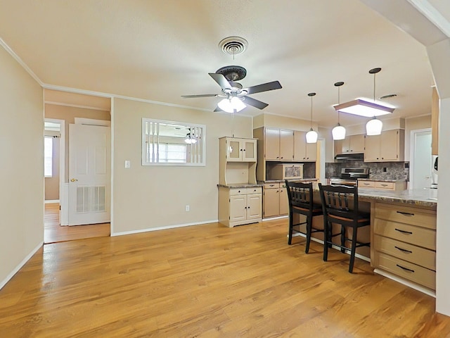 4532 Oakley Pirkle Rd, Martinez, GA 30907 - kitchen with light wood-type flooring, ornamental molding, a peninsula, decorative backsplash, and a kitchen bar