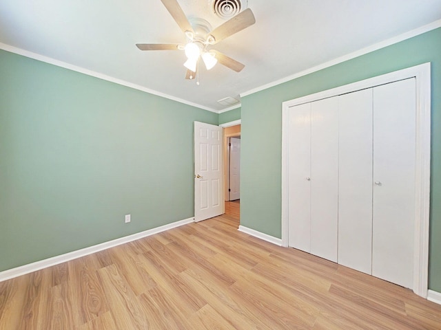 4532 Oakley Pirkle Rd, Martinez, GA 30907 - unfurnished bedroom with light wood finished floors, ornamental molding, a closet, and a ceiling fan