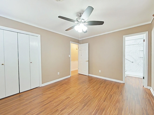 4532 Oakley Pirkle Rd, Martinez, GA 30907 - unfurnished bedroom featuring light wood-style flooring, a closet, crown molding, connected bathroom, and a ceiling fan