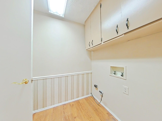 4532 Oakley Pirkle Rd, Martinez, GA 30907 - laundry area featuring cabinet space, hookup for a washing machine, and light wood-style floors