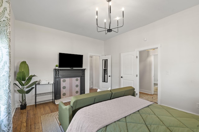 1118 Dantignac St, Augusta, GA 30901 - bedroom with a chandelier, wood finished floors, and baseboards