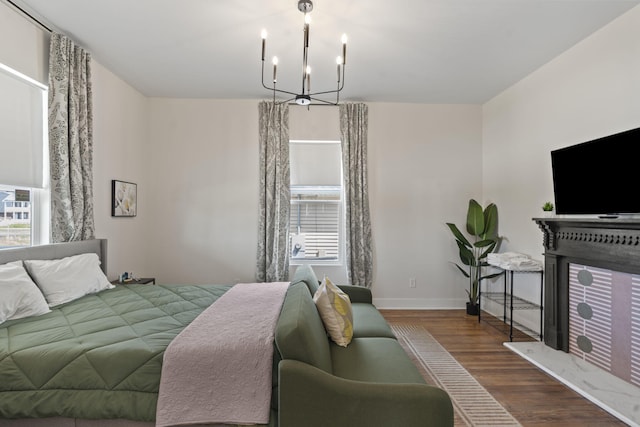 1118 Dantignac St, Augusta, GA 30901 - bedroom featuring multiple windows, wood finished floors, baseboards, and a chandelier