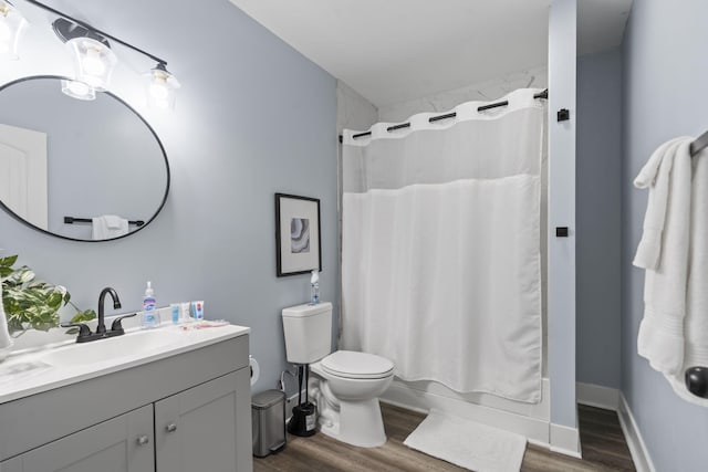 1118 Dantignac St, Augusta, GA 30901 - full bath featuring wood finished floors, toilet, vanity, and shower / tub combo