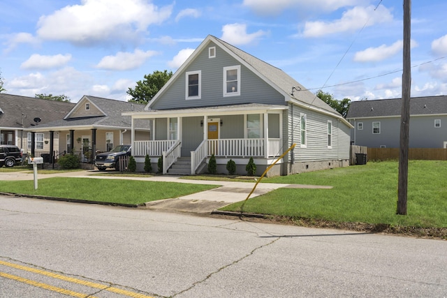 1118 Dantignac St, Augusta, GA 30901 - view of front of property with covered porch, crawl space, a front lawn, and central AC unit