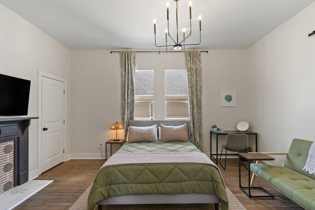 1118 Dantignac St, Augusta, GA 30901 - bedroom with a chandelier, wood finished floors, and baseboards