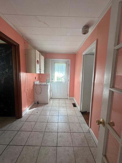 151 Lorrie St, Sardis, GA 30456 - corridor with light tile patterned floors and crown molding