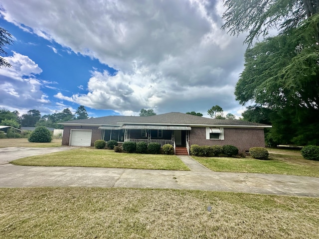 151 Lorrie St, Sardis, GA 30456 - single story home featuring a front lawn, covered porch, and a garage