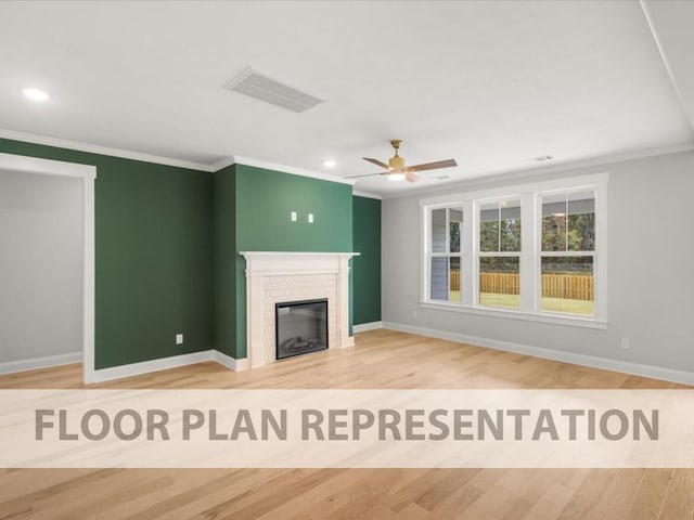 unfurnished living room with visible vents, crown molding, and wood finished floors