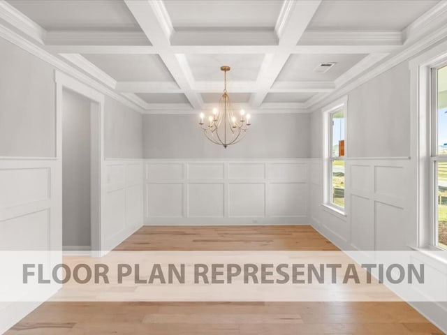 unfurnished dining area featuring crown molding, a chandelier, and coffered ceiling