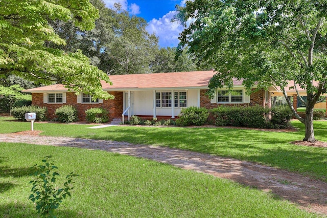 ranch-style home with a front lawn